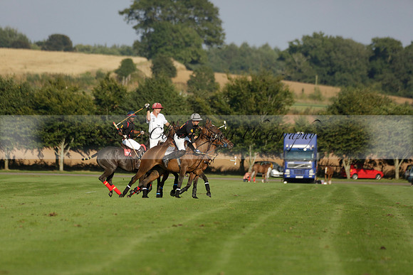 Pluma Negra (white) v Shoreline (black) in the Brecknock Cup Subsidiary final polo match played on Sunday 25 August 2013 at Cowdray Park Polo Club on Ambersham 1. 2013.10.12 www.polopictures.co.uk