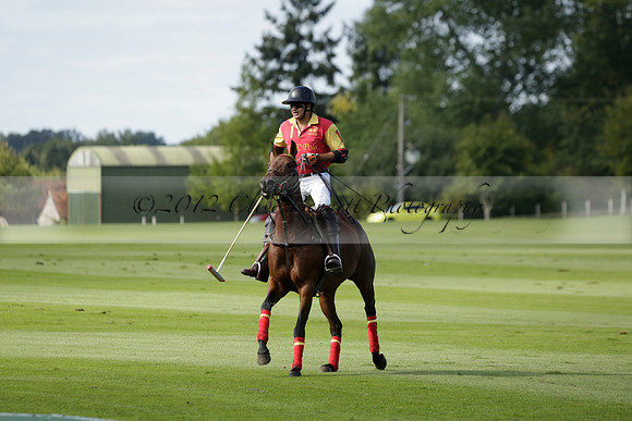 Four Quarters Black (black) v BHC (red) in a Autumn Cup polo match on Ambersham 2 at Cowdray Park Polo Club on Friday 20 September 2013 www.polopictures.co.uk