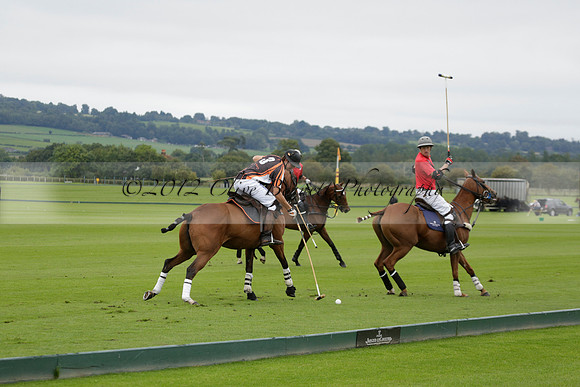 Four Quarters Black (black) v Clashleigh (red) in the Autumn Cup subsidiary final polo match on Ambersham 2 at Cowdray Park Polo Club on Sunday 22 September 2013 www.polopictures.co.uk