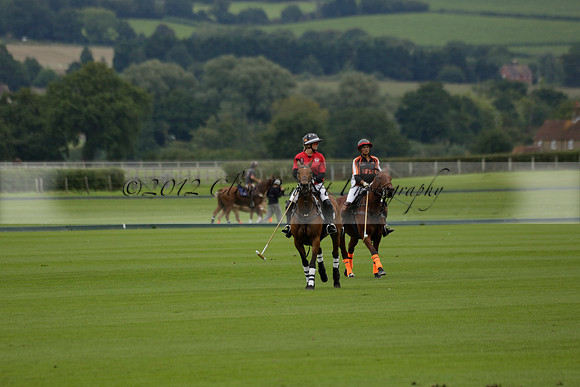 Four Quarters Black (black) v Clashleigh (red) in the Autumn Cup subsidiary final polo match on Ambersham 2 at Cowdray Park Polo Club on Sunday 22 September 2013 www.polopictures.co.uk