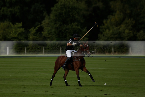 Aryana (black) v Shoreline (yellow) in a Farewell Cup polo match played on Ambersham 5 at Cowdray Park Polo Club on Wednesday 18 September 2013. www.polopictures.co.uk