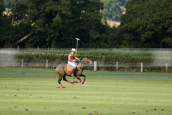Four Quarters Black (black) v BHC (red) in a Autumn Cup polo match on Ambersham 2 at Cowdray Park Polo Club on Friday 20 September 2013 www.polopictures.co.uk
