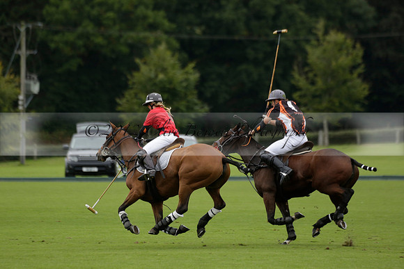 Four Quarters Black (black) v Clashleigh (red) in the Autumn Cup subsidiary final polo match on Ambersham 2 at Cowdray Park Polo Club on Sunday 22 September 2013 www.polopictures.co.uk