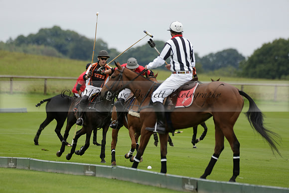 Four Quarters Black (black) v Clashleigh (red) in the Autumn Cup subsidiary final polo match on Ambersham 2 at Cowdray Park Polo Club on Sunday 22 September 2013 www.polopictures.co.uk