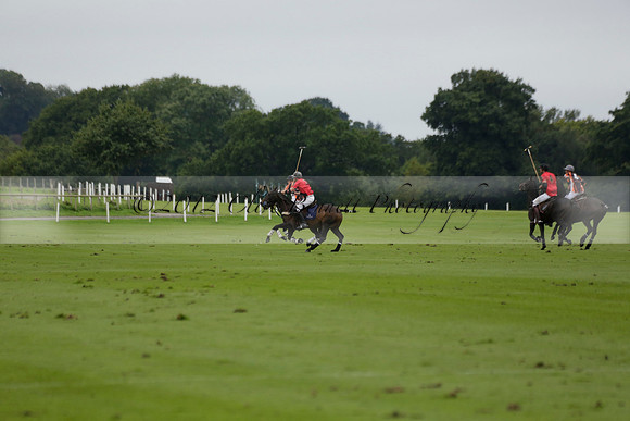 Four Quarters Black (black) v Clashleigh (red) in the Autumn Cup subsidiary final polo match on Ambersham 2 at Cowdray Park Polo Club on Sunday 22 September 2013 www.polopictures.co.uk