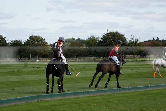 Four Quarters Black (black) v BHC (red) in a Autumn Cup polo match on Ambersham 2 at Cowdray Park Polo Club on Friday 20 September 2013 www.polopictures.co.uk