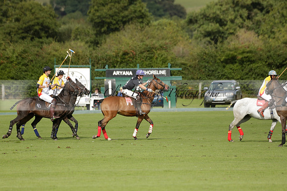 Aryana (black) v Shoreline (yellow) in a Farewell Cup polo match played on Ambersham 5 at Cowdray Park Polo Club on Wednesday 18 September 2013. www.polopictures.co.uk