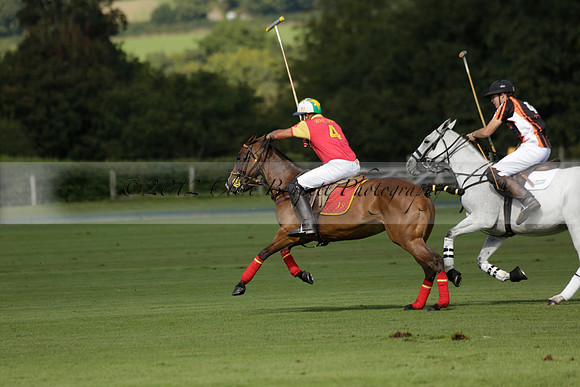 Four Quarters Black (black) v BHC (red) in a Autumn Cup polo match on Ambersham 2 at Cowdray Park Polo Club on Friday 20 September 2013 www.polopictures.co.uk