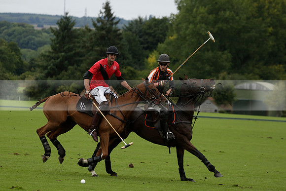 Four Quarters Black (black) v Clashleigh (red) in the Autumn Cup subsidiary final polo match on Ambersham 2 at Cowdray Park Polo Club on Sunday 22 September 2013 www.polopictures.co.uk