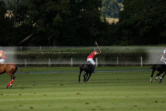 Four Quarters Black (black) v BHC (red) in a Autumn Cup polo match on Ambersham 2 at Cowdray Park Polo Club on Friday 20 September 2013 www.polopictures.co.uk