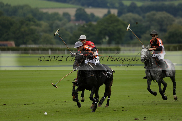 Four Quarters Black (black) v Clashleigh (red) in the Autumn Cup subsidiary final polo match on Ambersham 2 at Cowdray Park Polo Club on Sunday 22 September 2013 www.polopictures.co.uk