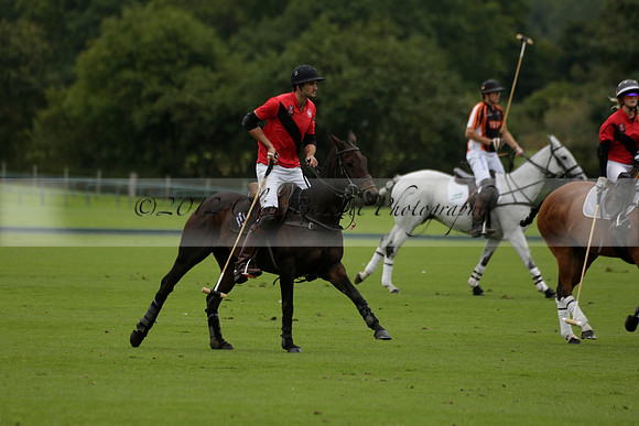 Four Quarters Black (black) v Clashleigh (red) in the Autumn Cup subsidiary final polo match on Ambersham 2 at Cowdray Park Polo Club on Sunday 22 September 2013 www.polopictures.co.uk