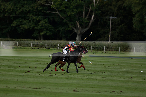 Four Quarters Black (black) v BHC (red) in a Autumn Cup polo match on Ambersham 2 at Cowdray Park Polo Club on Friday 20 September 2013 www.polopictures.co.uk