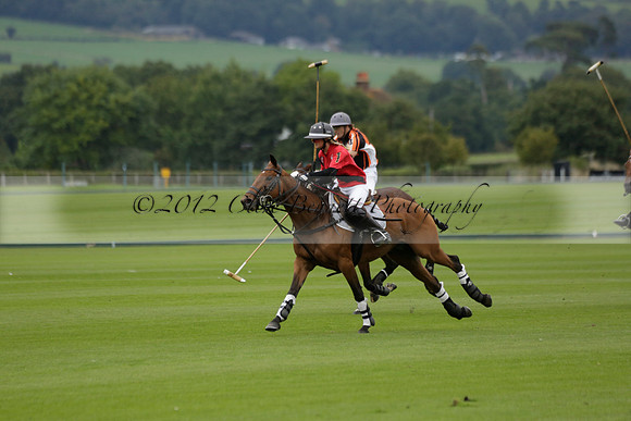 Four Quarters Black (black) v Clashleigh (red) in the Autumn Cup subsidiary final polo match on Ambersham 2 at Cowdray Park Polo Club on Sunday 22 September 2013 www.polopictures.co.uk