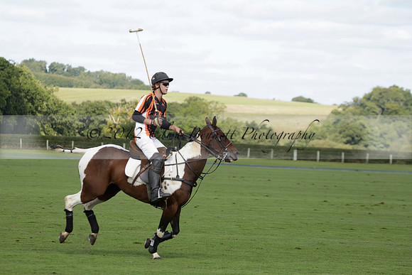 Four Quarters Black (black) v BHC (red) in a Autumn Cup polo match on Ambersham 2 at Cowdray Park Polo Club on Friday 20 September 2013 www.polopictures.co.uk