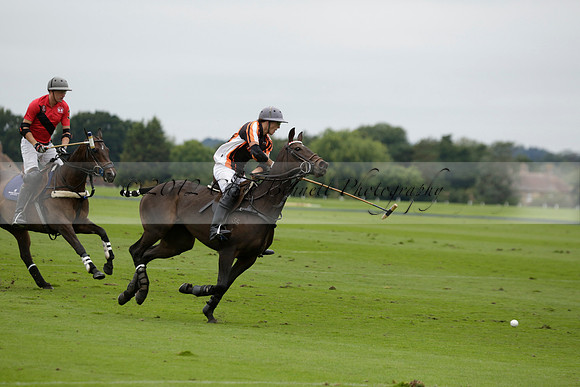 Four Quarters Black (black) v Clashleigh (red) in the Autumn Cup subsidiary final polo match on Ambersham 2 at Cowdray Park Polo Club on Sunday 22 September 2013 www.polopictures.co.uk