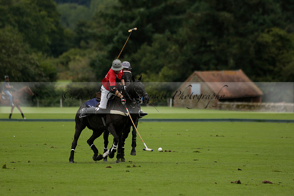 Four Quarters Black (black) v Clashleigh (red) in the Autumn Cup subsidiary final polo match on Ambersham 2 at Cowdray Park Polo Club on Sunday 22 September 2013 www.polopictures.co.uk