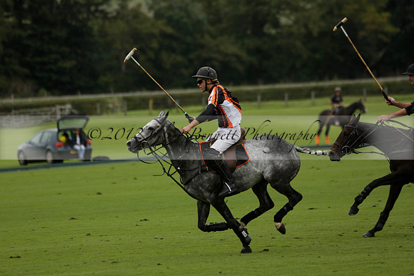 Four Quarters Black (black) v Clashleigh (red) in the Autumn Cup subsidiary final polo match on Ambersham 2 at Cowdray Park Polo Club on Sunday 22 September 2013 www.polopictures.co.uk