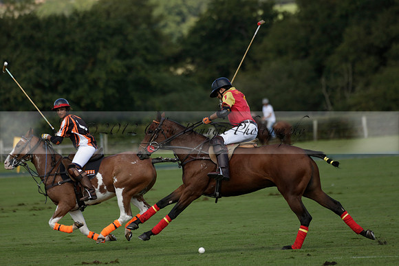 Four Quarters Black (black) v BHC (red) in a Autumn Cup polo match on Ambersham 2 at Cowdray Park Polo Club on Friday 20 September 2013 www.polopictures.co.uk