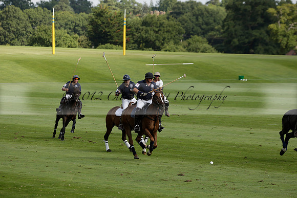 Pandas (white) v Home Farm (navy) in a Park House West Sussex Cup Polo match on Brooksfield at Cowdray Park Polo Club on Friday 30 August 2013. 2013.08.30 www.polopictures.co.uk