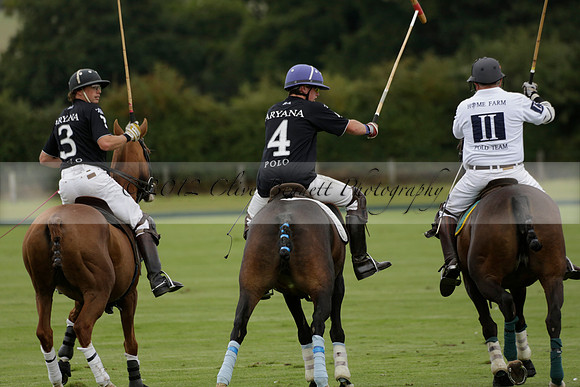 Aryana (black) v Home Farm (white) in a Farewell Cup polo match played on Ambersham 5 at Cowdray Park Polo Club on Wednesday 2013.09.11 www.polopictures.co.uk