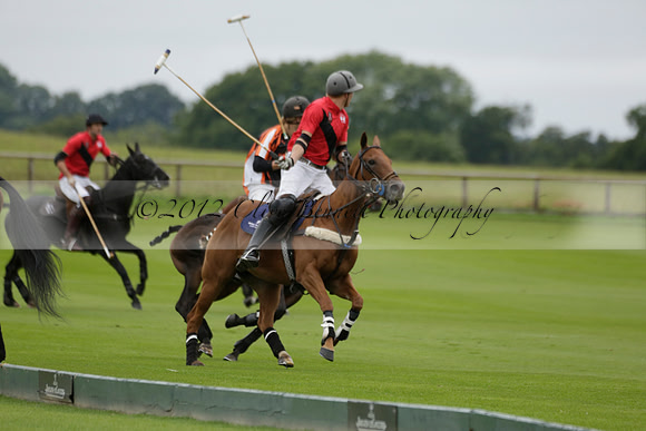 Four Quarters Black (black) v Clashleigh (red) in the Autumn Cup subsidiary final polo match on Ambersham 2 at Cowdray Park Polo Club on Sunday 22 September 2013 www.polopictures.co.uk