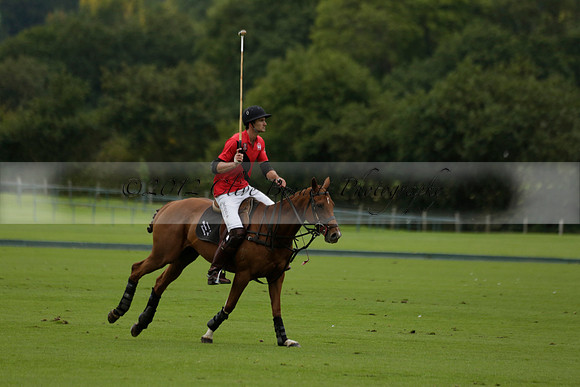 Four Quarters Black (black) v Clashleigh (red) in the Autumn Cup subsidiary final polo match on Ambersham 2 at Cowdray Park Polo Club on Sunday 22 September 2013 www.polopictures.co.uk