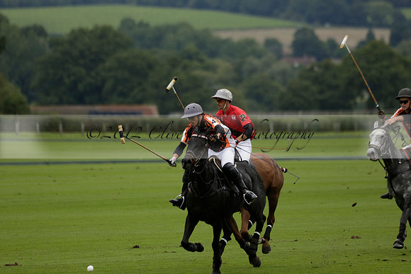 Four Quarters Black (black) v Clashleigh (red) in the Autumn Cup subsidiary final polo match on Ambersham 2 at Cowdray Park Polo Club on Sunday 22 September 2013 www.polopictures.co.uk