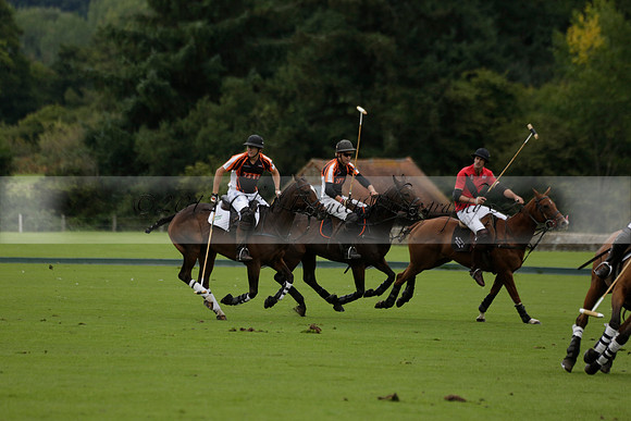 Four Quarters Black (black) v Clashleigh (red) in the Autumn Cup subsidiary final polo match on Ambersham 2 at Cowdray Park Polo Club on Sunday 22 September 2013 www.polopictures.co.uk