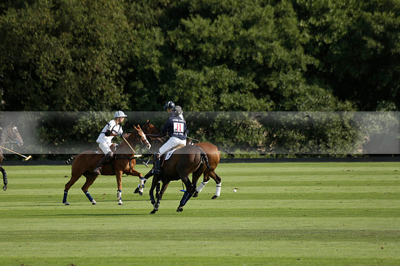 Pandas (white) v Home Farm (navy) in a Park House West Sussex Cup Polo match on Brooksfield at Cowdray Park Polo Club on Friday 30 August 2013. 2013.08.30 www.polopictures.co.uk