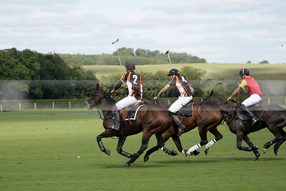 Four Quarters Black (black) v BHC (red) in a Autumn Cup polo match on Ambersham 2 at Cowdray Park Polo Club on Friday 20 September 2013 www.polopictures.co.uk