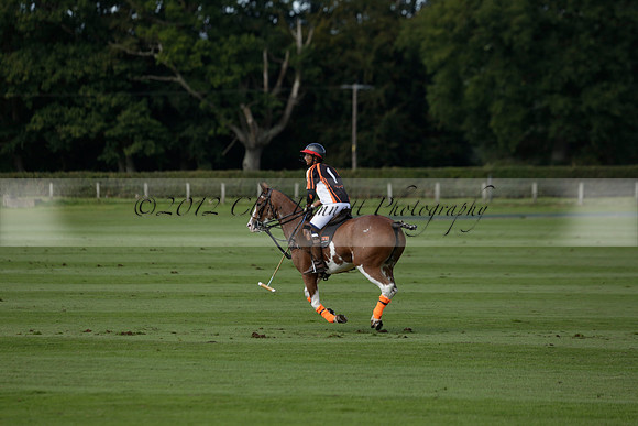 Four Quarters Black (black) v BHC (red) in a Autumn Cup polo match on Ambersham 2 at Cowdray Park Polo Club on Friday 20 September 2013 www.polopictures.co.uk