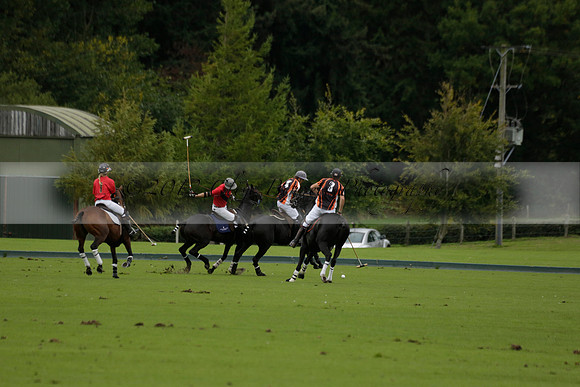 Four Quarters Black (black) v Clashleigh (red) in the Autumn Cup subsidiary final polo match on Ambersham 2 at Cowdray Park Polo Club on Sunday 22 September 2013 www.polopictures.co.uk