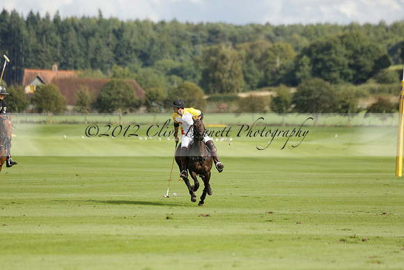Aryana (black) v Shoreline (yellow) in a Farewell Cup polo match played on Ambersham 5 at Cowdray Park Polo Club on Wednesday 18 September 2013. www.polopictures.co.uk