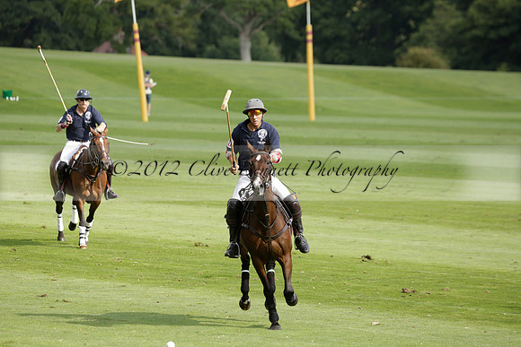 Pandas (white) v Home Farm (navy) in a Park House West Sussex Cup Polo match on Brooksfield at Cowdray Park Polo Club on Friday 30 August 2013. 2013.08.30 www.polopictures.co.uk