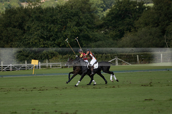 Four Quarters Black (black) v BHC (red) in a Autumn Cup polo match on Ambersham 2 at Cowdray Park Polo Club on Friday 20 September 2013 www.polopictures.co.uk