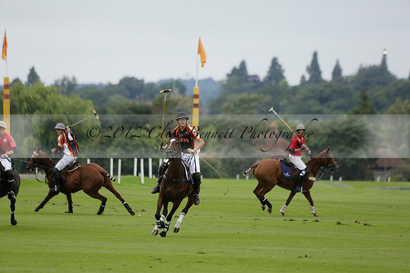 Four Quarters Black (black) v Clashleigh (red) in the Autumn Cup subsidiary final polo match on Ambersham 2 at Cowdray Park Polo Club on Sunday 22 September 2013 www.polopictures.co.uk