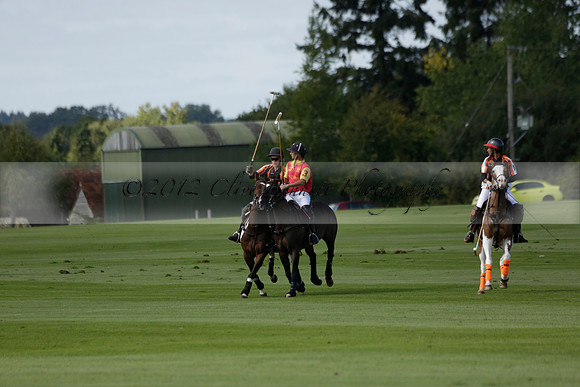 Four Quarters Black (black) v BHC (red) in a Autumn Cup polo match on Ambersham 2 at Cowdray Park Polo Club on Friday 20 September 2013 www.polopictures.co.uk