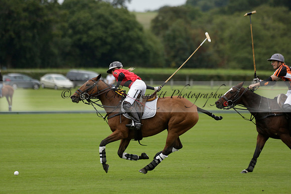 Four Quarters Black (black) v Clashleigh (red) in the Autumn Cup subsidiary final polo match on Ambersham 2 at Cowdray Park Polo Club on Sunday 22 September 2013 www.polopictures.co.uk
