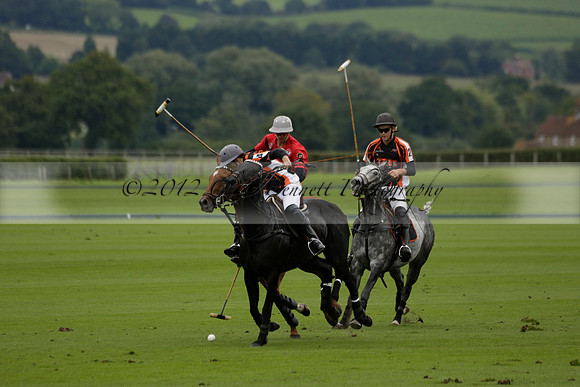 Four Quarters Black (black) v Clashleigh (red) in the Autumn Cup subsidiary final polo match on Ambersham 2 at Cowdray Park Polo Club on Sunday 22 September 2013 www.polopictures.co.uk