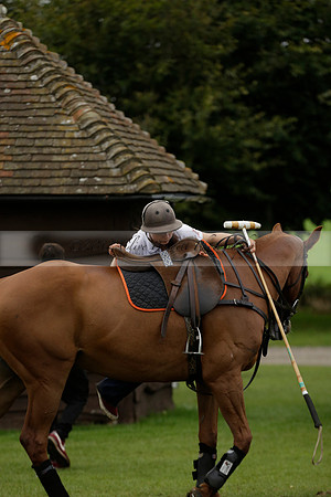 Four Quarters Black (black) v Clashleigh (red) in the Autumn Cup subsidiary final polo match on Ambersham 2 at Cowdray Park Polo Club on Sunday 22 September 2013 www.polopictures.co.uk