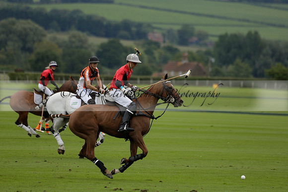 Four Quarters Black (black) v Clashleigh (red) in the Autumn Cup subsidiary final polo match on Ambersham 2 at Cowdray Park Polo Club on Sunday 22 September 2013 www.polopictures.co.uk