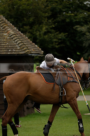 Four Quarters Black (black) v Clashleigh (red) in the Autumn Cup subsidiary final polo match on Ambersham 2 at Cowdray Park Polo Club on Sunday 22 September 2013 www.polopictures.co.uk