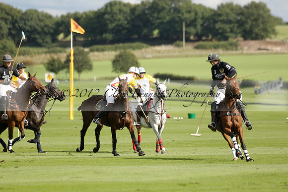 Aryana (black) v Shoreline (yellow) in a Farewell Cup polo match played on Ambersham 5 at Cowdray Park Polo Club on Wednesday 18 September 2013. www.polopictures.co.uk