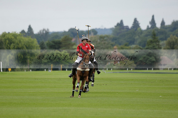 Four Quarters Black (black) v Clashleigh (red) in the Autumn Cup subsidiary final polo match on Ambersham 2 at Cowdray Park Polo Club on Sunday 22 September 2013 www.polopictures.co.uk
