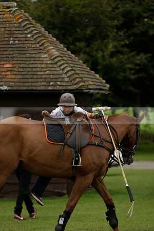 Four Quarters Black (black) v Clashleigh (red) in the Autumn Cup subsidiary final polo match on Ambersham 2 at Cowdray Park Polo Club on Sunday 22 September 2013 www.polopictures.co.uk