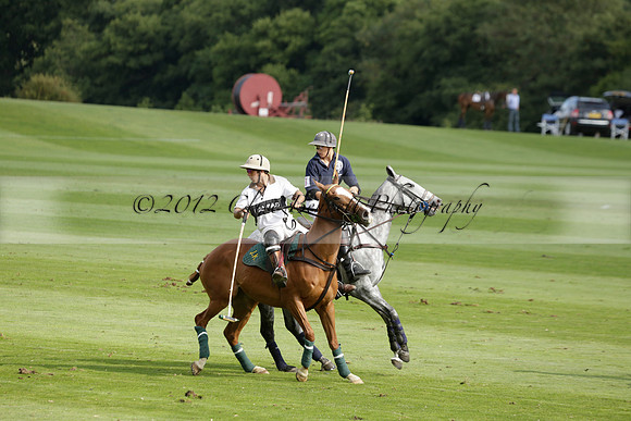 Pandas (white) v Home Farm (navy) in a Park House West Sussex Cup Polo match on Brooksfield at Cowdray Park Polo Club on Friday 30 August 2013. 2013.08.30 www.polopictures.co.uk