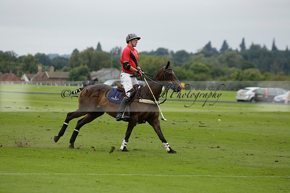 Four Quarters Black (black) v Clashleigh (red) in the Autumn Cup subsidiary final polo match on Ambersham 2 at Cowdray Park Polo Club on Sunday 22 September 2013 www.polopictures.co.uk