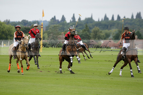 Four Quarters Black (black) v Clashleigh (red) in the Autumn Cup subsidiary final polo match on Ambersham 2 at Cowdray Park Polo Club on Sunday 22 September 2013 www.polopictures.co.uk