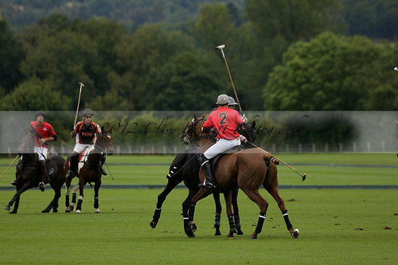 Four Quarters Black (black) v Clashleigh (red) in the Autumn Cup subsidiary final polo match on Ambersham 2 at Cowdray Park Polo Club on Sunday 22 September 2013 www.polopictures.co.uk